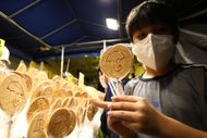 Squid Game causes soaring popularity for nostalgic Korean candies - Image via: Getty